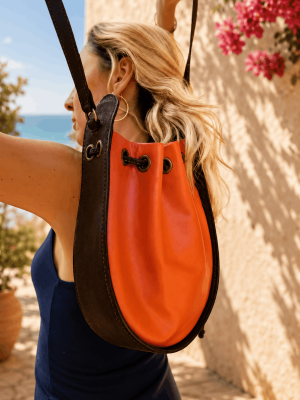 Orange and brown round handmade genuine leather shoulder bag with strap detail