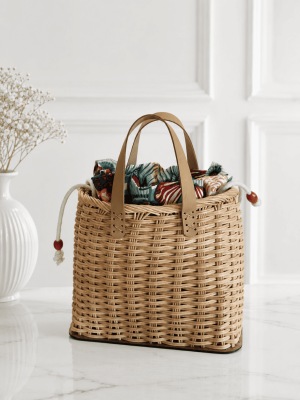 Handmade rattan tote bag for women with woven design and leather handles