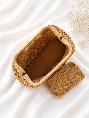 Interior view of handmade straw handbag with removable organizer pouch, beige woven tote bag for women